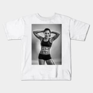 Fitness woman posing in studio Kids T-Shirt